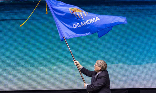 OKFB President Rodd Moesel presents the Oklahoma Flag at the 2023 AFBF Convention.