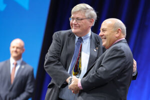 Oklahoma Farm Bureau President Rodd Moesel receives the 2023 AFBF New Horizon Award from AFBF president Zippy Duvall during the 2024 AFBF Convention in Salt Lake City.