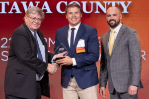 Oklahoma Farm Bureau President Rodd Moesel (left) and OKFB Young Farmers & Ranchers coordinator Zac Swartz (right) present Dillon Johnson with the 2022 OKFB YF&R Discussion Meet Award on Saturday, Nov. 12 at the 2022 Oklahoma Farm Bureau Annual meeting in Norman, OK.