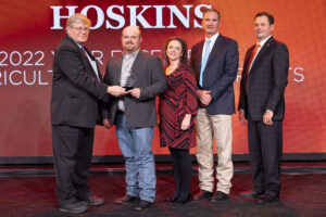 Oklahoma Farm Bureau President Rodd Moesel (left) presents Rogers County Farm Bureau members Chris and Ashley Hoskins with the 2022 OKFB Young Farmers & Ranchers Excellence in Agriculture Award on Saturday, Nov. 12 at the 2022 Oklahoma Farm Bureau Annual meeting in Norman, OK. Also pictured are Patrick Zeta, president and chief executive officer of Oklahoma AgCredit, and John Grunewald, chief executive officer of Farm Credit of Western Oklahoma, who sponsored the award prizes.