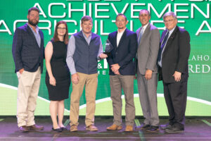 Garrett Haskins (third from left) of Kay County receives the 2024vOklahoma Farm Bureau Young Farmers & Ranchers Achievement Award on Saturday, Nov. 11 at the 2023 Oklahoma Farm Bureau Annual meeting in Oklahoma City.