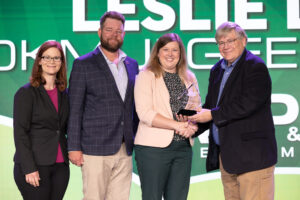 Oklahoma Farm Bureau Young Farmers & Ranchers chairs Alisen and Jared Anderson (left) and OKFB President Rodd Moesel (right) present Leslie Lewis her award as the 2023 OKFB YF&R Discussion Meet winner on Saturday, Nov. 11 at the 2023 Oklahoma Farm Bureau Annual meeting in Oklahoma City.