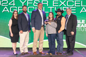 LC and Jaclyn Darling (second and third from right) of Coal County receive the 2024 Oklahoma Farm Bureau Young Farmers & Ranchers Excellence in Agriculture Award on Saturday, Nov. 11 at the 2023 Oklahoma Farm Bureau Annual meeting in Oklahoma City.